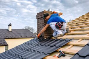 Homeowner inspecting gutters and roof edges from the ground before a dark summer storm.